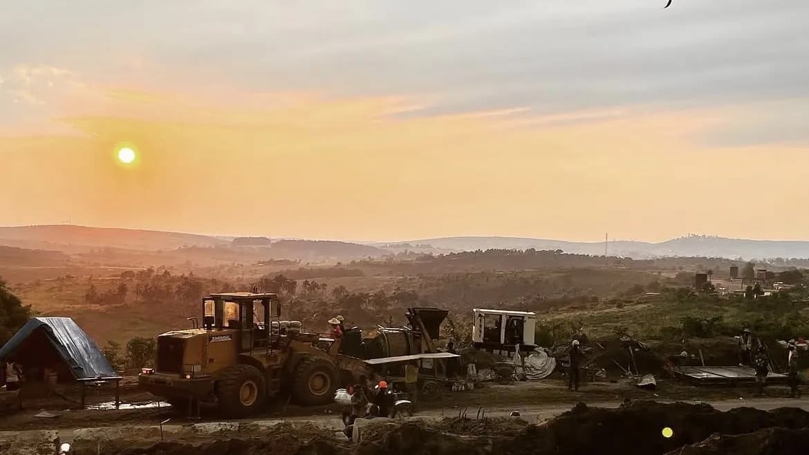 Machines at work on the Kasangulu land, at sunset.